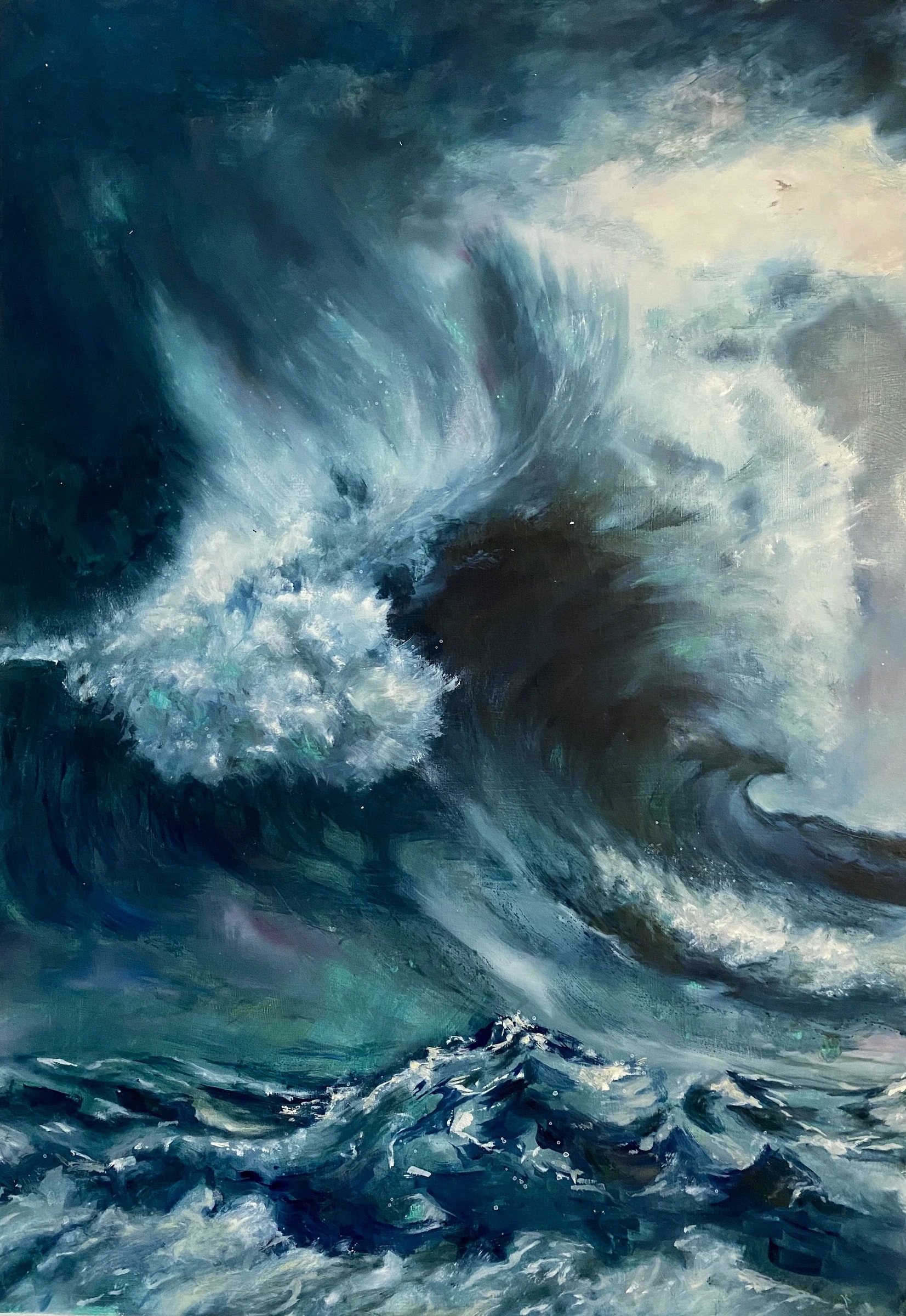 Seascape of a tall breaking wave curling at left, its crest torn into white spray, over churning teal and near-black water under a blue-green sky.